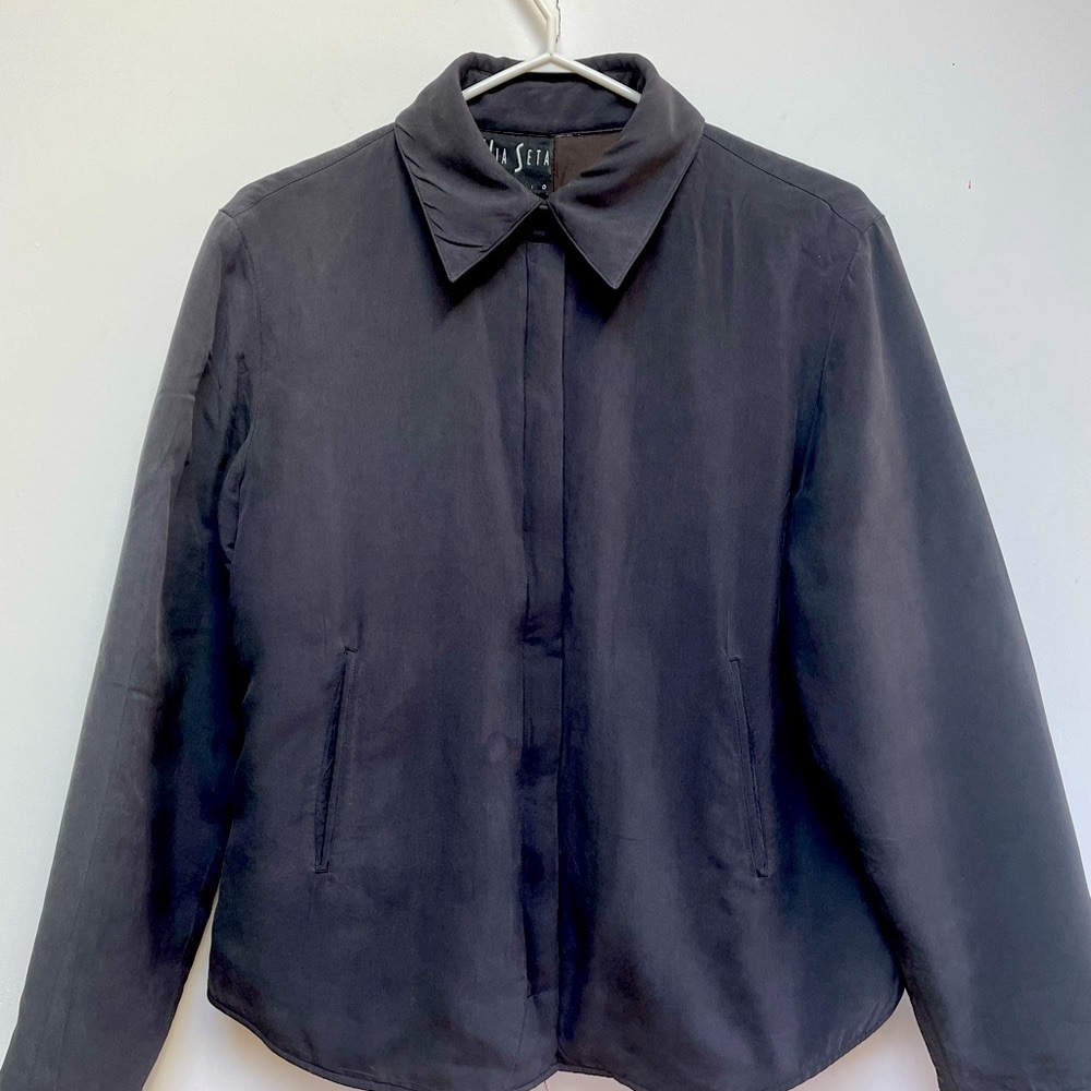 Silk jacket with zipper closing. Fully lined. Slightly padded. slash pockets.